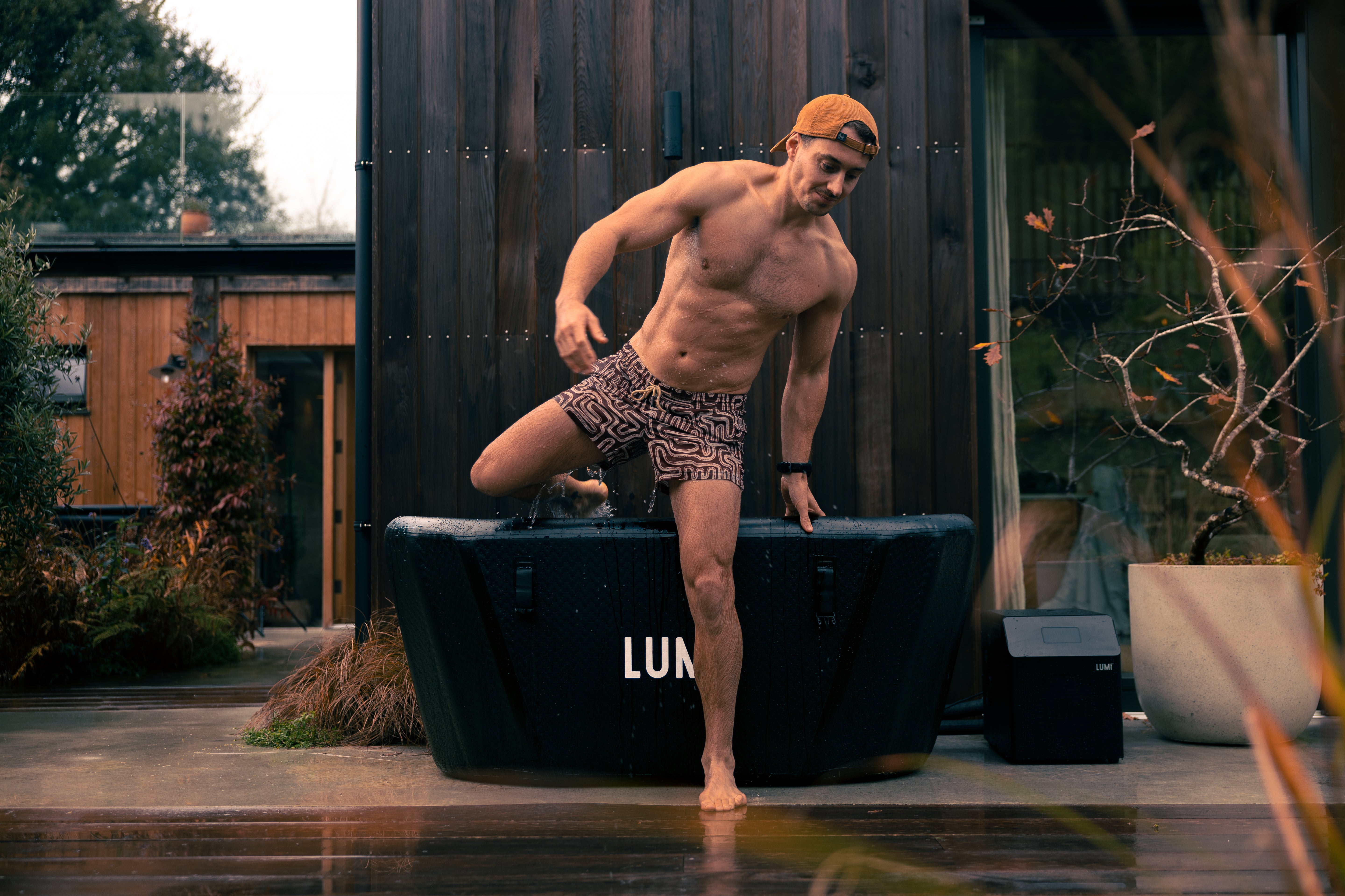 A man getting out of a LUMI Pro ice bath