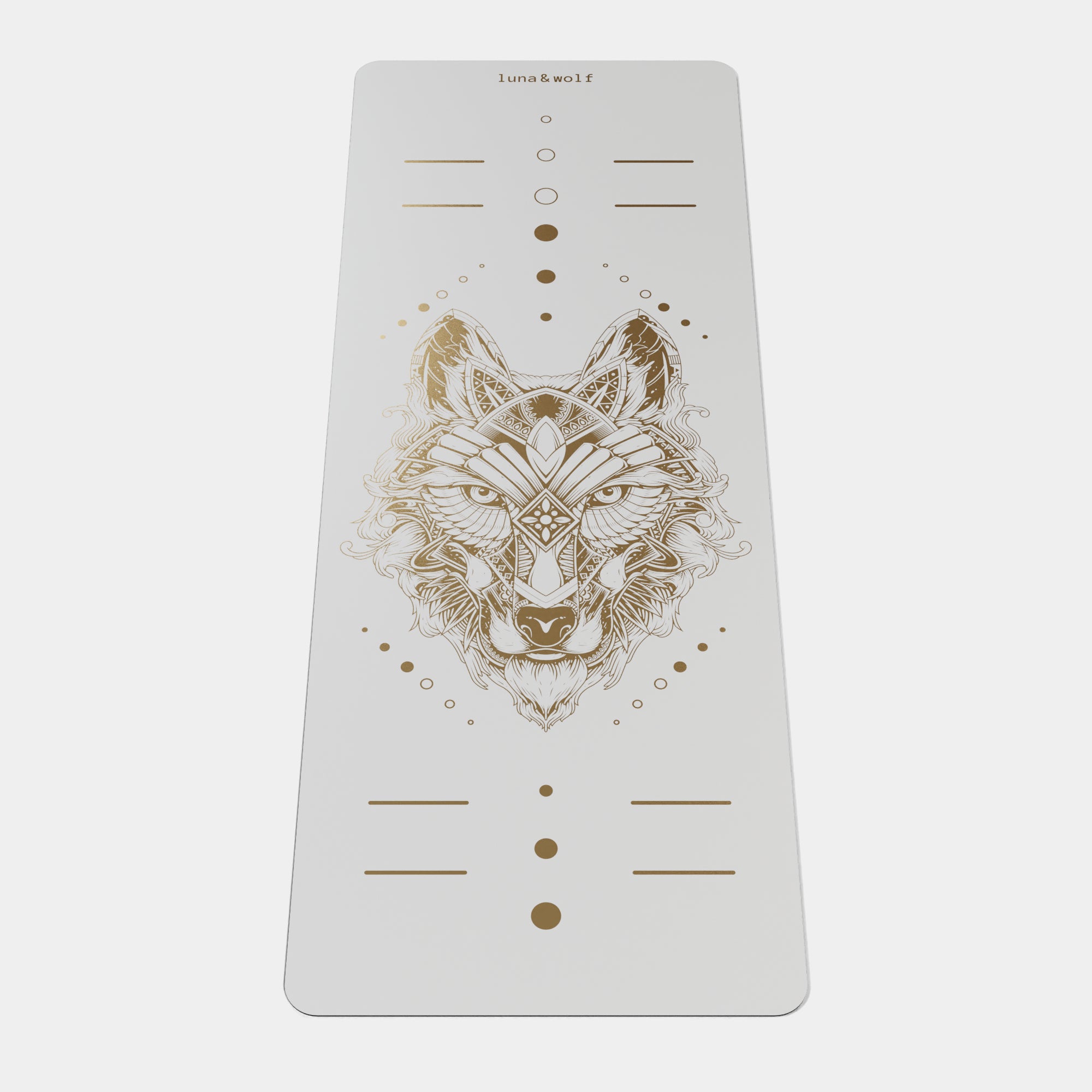 Eco Wolf Yoga Mat - Gold Edition featuring a white mat with intricate geometric wolf head design in metallic gold, alignment markers, and Luna & Wolf branding. Premium non-slip exercise mat with artistic positioning dots and lines.