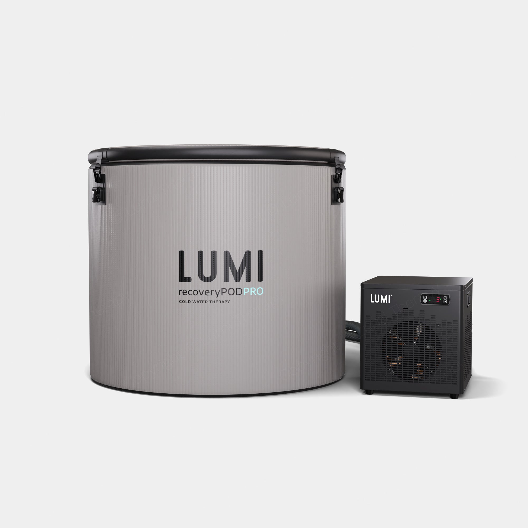 Pod PRO Ice Barrel with Cube Chiller featuring a sleek grey cylindrical barrel with LUMI branding and a connected black cooling unit. Professional-grade cold therapy system with modern minimalist design for effective temperature control and recovery.