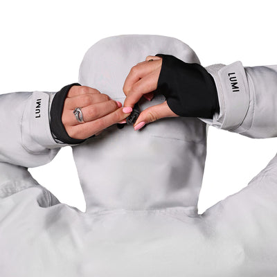 PRO DUO Changing Robe in grey shown from behind, featuring adjustable hood detail and black fingerless cuffs with LUMI branding. Close-up view highlighting the waterproof material and premium construction of this Nordic-style outdoor changing robe.