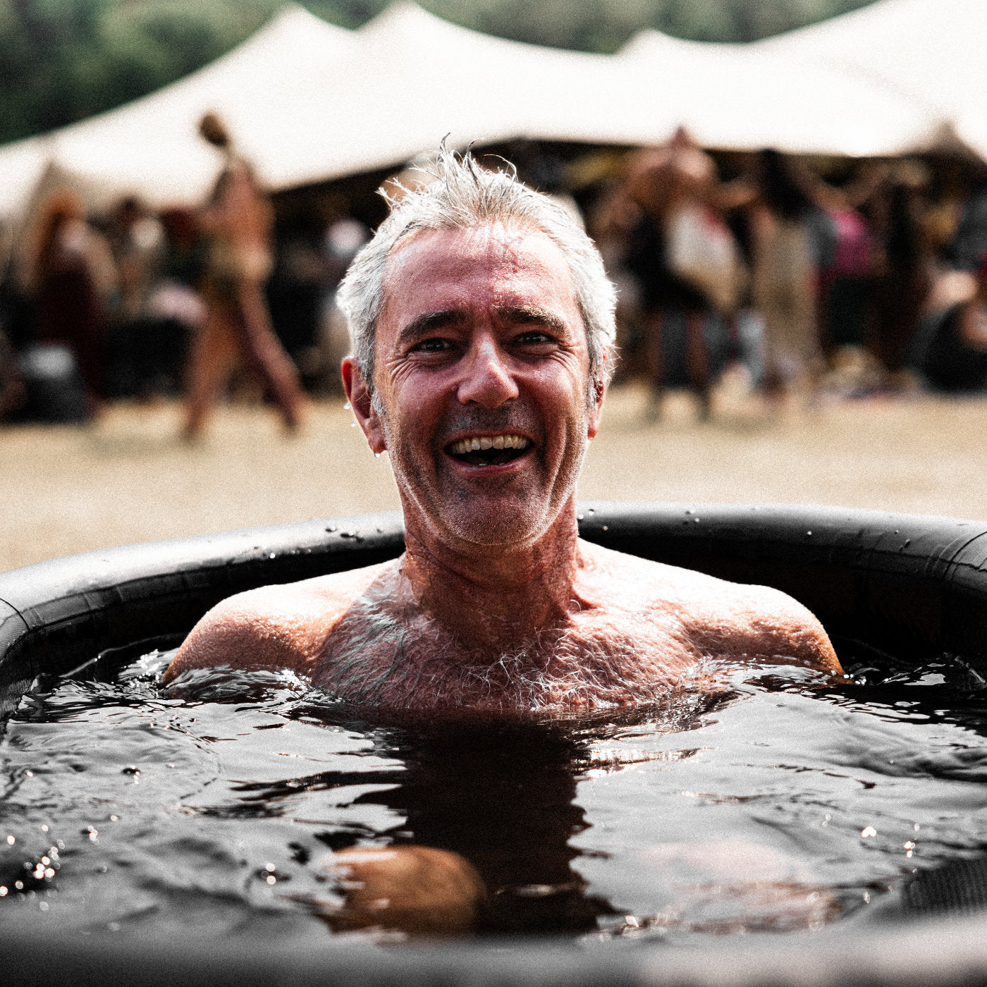 A man enjoying the benefits of cold water therapy in a LUMI ice bath