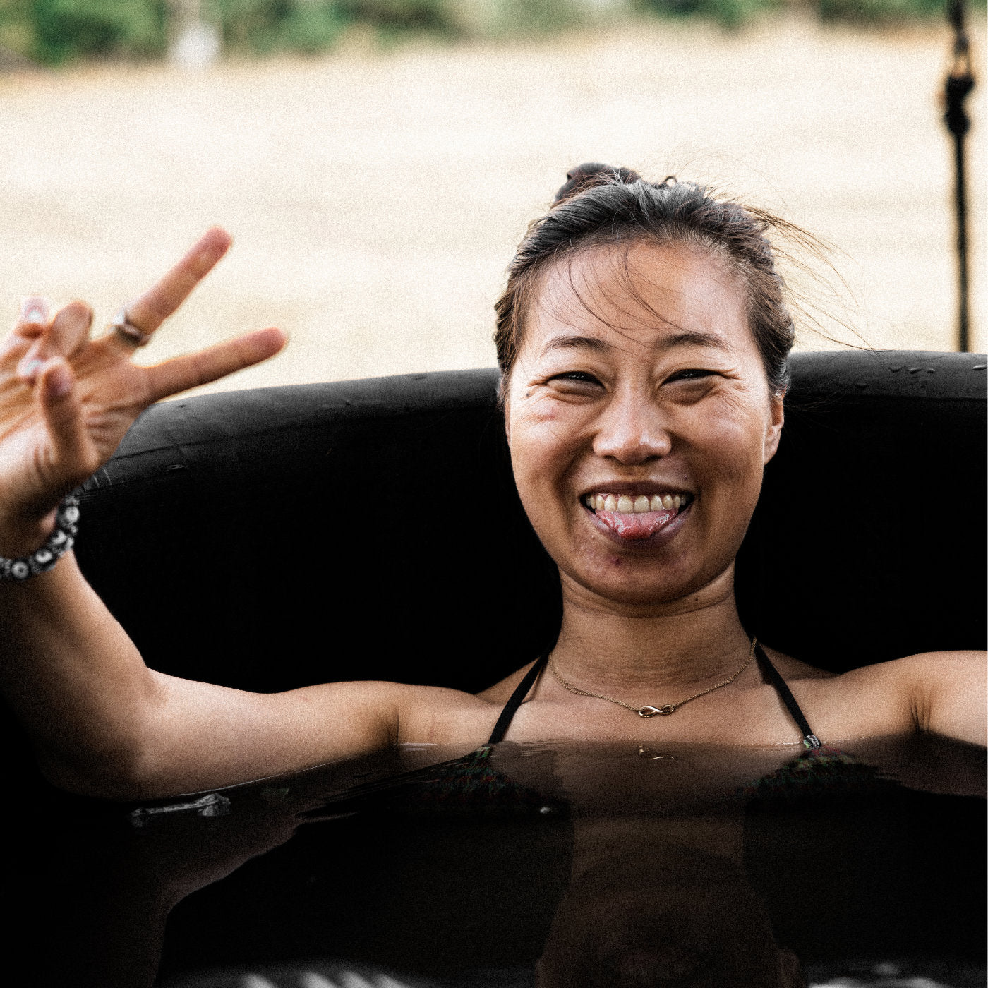 A woman enjoying the benefits of cold water therapy in a LUMI ice bath