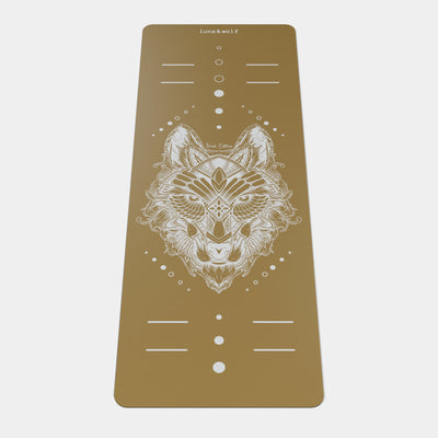 Eco Wolf Yoga Mat - Nude Edition featuring an elegant white geometric wolf head design with alignment markers on a warm earth-toned background. Premium non-slip yoga mat with circular position guides and minimalist Luna & Wolf branding.