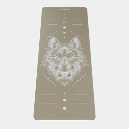 Eco Wolf Yoga Mat - Nude Edition featuring a geometric white wolf head design on a neutral taupe background, with alignment markers and decorative circles. Premium 4mm eco-friendly exercise mat with non-slip surface and positioning guides.