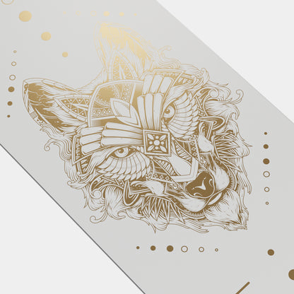 Eco Wolf Yoga Mat - Gold Edition featuring an intricate gold geometric wolf head design with ornate patterns, wings, and decorative circles on a light grey premium yoga mat surface. The artistic illustration combines tribal and modern elements in metallic gold finish.