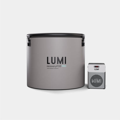 Pod PRO Ice Barrel with miniUltra Chiller: Professional recovery system featuring a stone grey cylindrical barrel with black trim alongside a compact silver chiller unit. The LUMI branded barrel and chiller create a modern, minimalist cold therapy setup for optimal recovery.